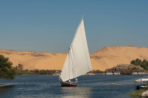 Aswan, Egypt. December 10th 2022 Beautiful landscape view of an Egyptian Felucca sail boat along