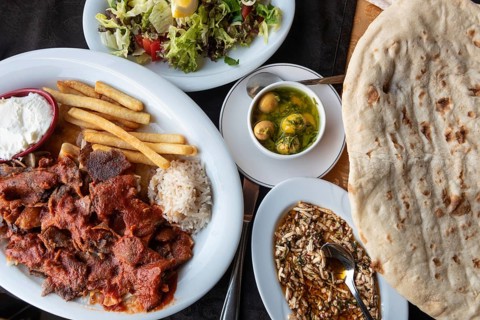 Alanya, Turkey. April 8th 2021 Plate of Iskender or Bursa Kebab with a Turkish mezze and