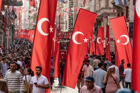 Istanbul, Turkey. October 29th 2023 Crowds flock between the many flags in Istiklal Street,