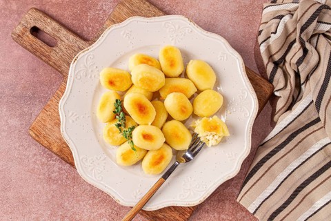 Stuffed gnocchi with cheese, Italian dumplings, garnished with parmesan cheese, no people