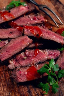 Fried steak, beef steak, rib eye steak, sliced steak, on a chopping board, top view, no people