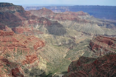 Steep canyons and valleys stretch through an earthy and vast landscape, Grand Canyon National Park,