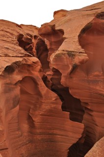 Massive sandstone structures with dramatic fissures, entrance to Antelope Canyon, Navajo Nation