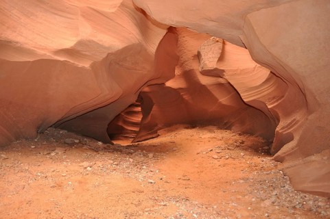 Soil of sand and rocks in an open natural cave with soft curves, Antelope Canyon, Navajo Nation
