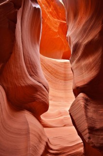 Strong shadows in a dramatic sandstone gorge in shades of orange with bright colors, Antelope