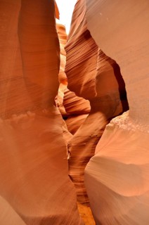 Narrow passage of smooth, organically shaped orange sandstone, Antelope Canyon, Navajo Nation