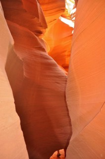 Narrow passage of smooth orange sandstone forming a natural rock formation, Antelope Canyon, Navajo