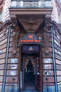 Entrance with atlases, 19th century tenement house, today Café, Lemberg, Ukraine