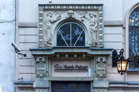 Art Nouveau relief over an entrance to a ban, around 1900, Krakow, Poland