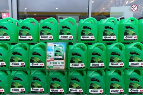 Canister with cleaning water at a gas station, Krakow, Poland