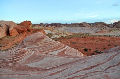 Rock formations with distinctive red and white stripes under a blue sky, Valley of Fire State Park,