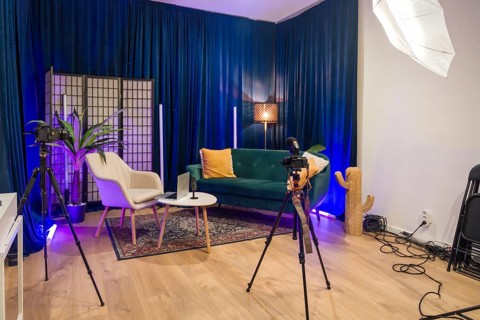 Modern content creation studio set up for video recording and podcast production, featuring