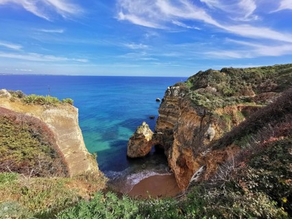 Picturesque coastal landscape with high cliffs and turquoise blue sea, Lagos, Algarve, Portugal