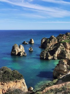 Spectacular seascape with unique rock formations in clear water, Lagos, Algarve, Portugal