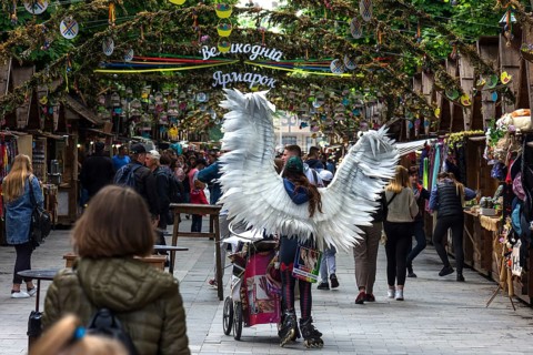 Promotional campaign with an angel costume on Svoboda Prospekt, Lviv, Ukraine