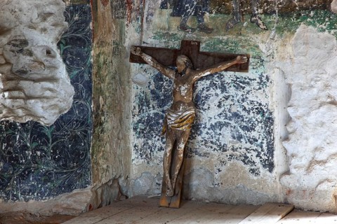 Interior frescoes and crucifix of the chapel in the fortified church of Honigberg, Harman,