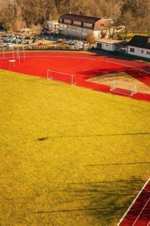 Close-up of a sports field with running track and shade on the grass, Wimberg, Calw, Germany
