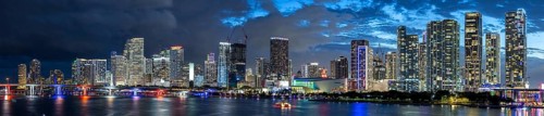 Miami skyline with high-rise real estate in downtown ocean panorama at night in Miami, USA