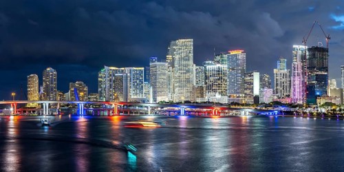 Miami skyline with high-rise real estate in downtown panoramic ocean view at night in Miami, USA