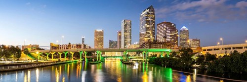 Tampa skyline with skyscrapers and bridge over Hillsborough River at night panorama in downtown