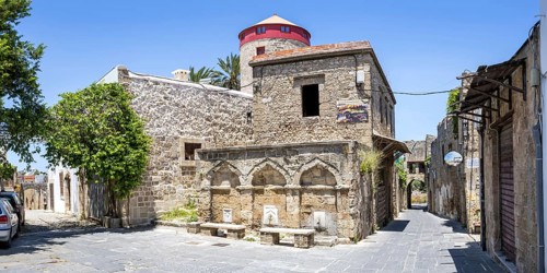 Ottoman fountain and windmill in the historic old town from the Middle Ages panorama on the island