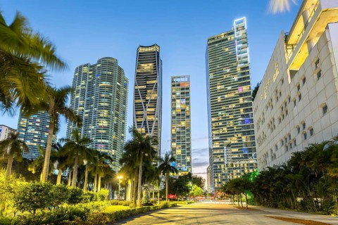 Miami skyline with high-rise real estate at night at Maurice A. Ferre Park in Miami, USA