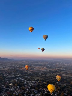 Panoramic aerial view of Mexico Teotihuacan pyramids. Hot air balloons flying over the Mexican
