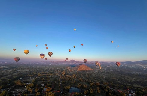 Panoramic aerial view of Mexico Teotihuacan pyramids. Hot air balloons flying over the Mexican