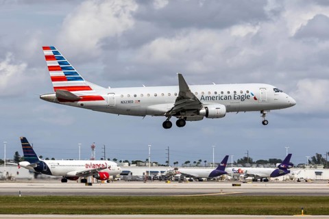 An American Eagle Envoy Air Embraer 175 aircraft with license plate N323ED at Miami airport, USA