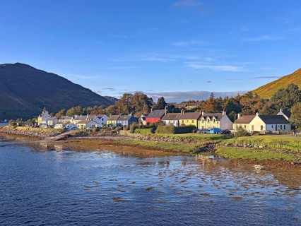 Small coastal village with views of the sea and surrounding mountains, Dornie, Eilean Donan Castle,