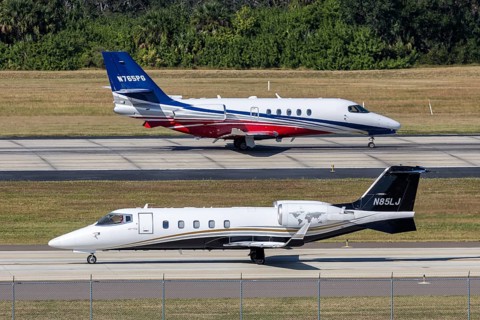Bombardier Learjet and Cessna Citation Latitude private jet aircraft with license plate N85LJ at