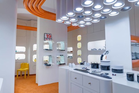 Futuristic interior with white design and eye-catching orange and white lighting