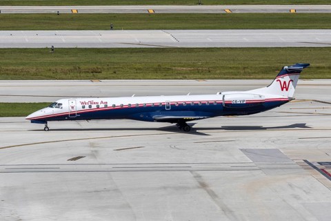 A Western Air Embraer 145 aircraft with the license plate C6-VIP at Fort Lauderdale airport, USA
