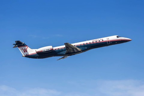 A Western Air Embraer 145 aircraft with the license plate C6-SAW at Fort Lauderdale airport, USA