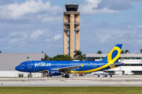 A JetBlue Airways Airbus A320 aircraft with license plate N775JB and JetBlue Honors our Veterans