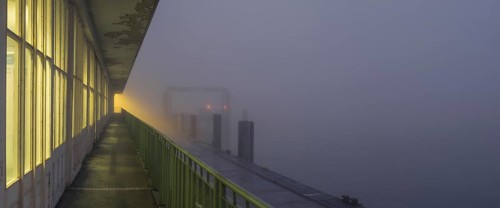 View along a long balcony of Steubenhöft of the ferry dock at Lübbenkai in fog, Cuxhaven, Lower