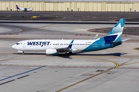 A Westjet Airlines Boeing 737-800 aircraft with the license plate C-FRWA at Phoenix airport, USA