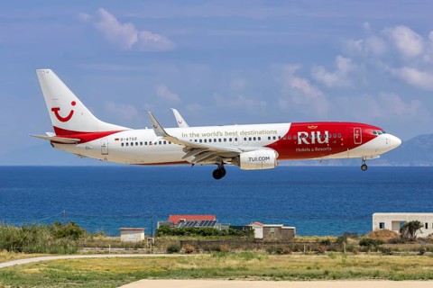 A TUI Boeing 737-800 aircraft with the D-ATUZ license plate and RIU Hotels & Resorts special livery