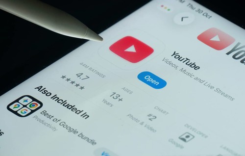 Dhaka, Bangladesh- 30 Oct 2025: Youtube app on a iPad screen with a pen pointing at the install
