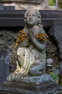 Praying sculpture at Lützenhofer cemetery Lychakivsky cemetery, Lviv, Galicia, Ukraine