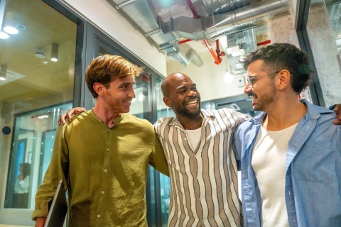 Smiling multiracial business professionals enjoying a moments of friendship and camaraderie,