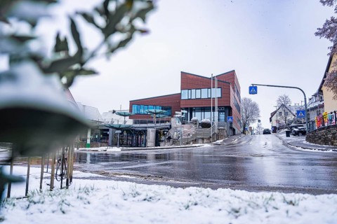 Modern architecture town hall, in a snowy town, quiet atmosphere with snowy street, Gechingen, Calw