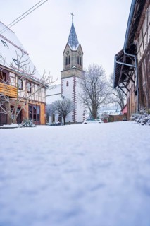 Historic church tower in a snowy village, quiet and rural winter atmosphere, Gechingen, Calw