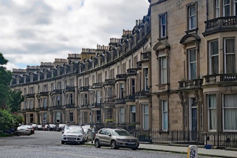 A curve with elegant townhouses and parked cars in a residential area, Newtown, Edinburgh,