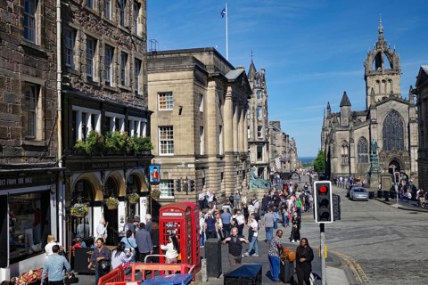 A lively street scene with Gothic buildings and lots of people, Royal Mile, Edinburgh, Scotland,