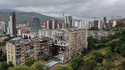 Panoramic view of a residential area with construction cranes and high-rise buildings, Tbilisi,