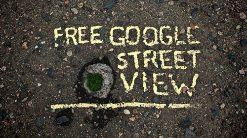 Concrete bridge with hole in asphalt with yellow text 'Free Google Street View, 'funny, Tbilisi,
