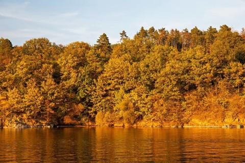 Brno Reservoir (Brnenská prehrada) on the Svratka River on a sunny autumn day. The reservoir is