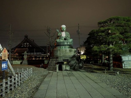 Large Buddha statue in front of a temple, calm atmosphere at night, Zenko-ji Temple, Nagano, Japan