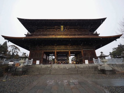 Large traditional temple in Japan, illuminated at night, majestic and impressive, Zenko-ji Temple,